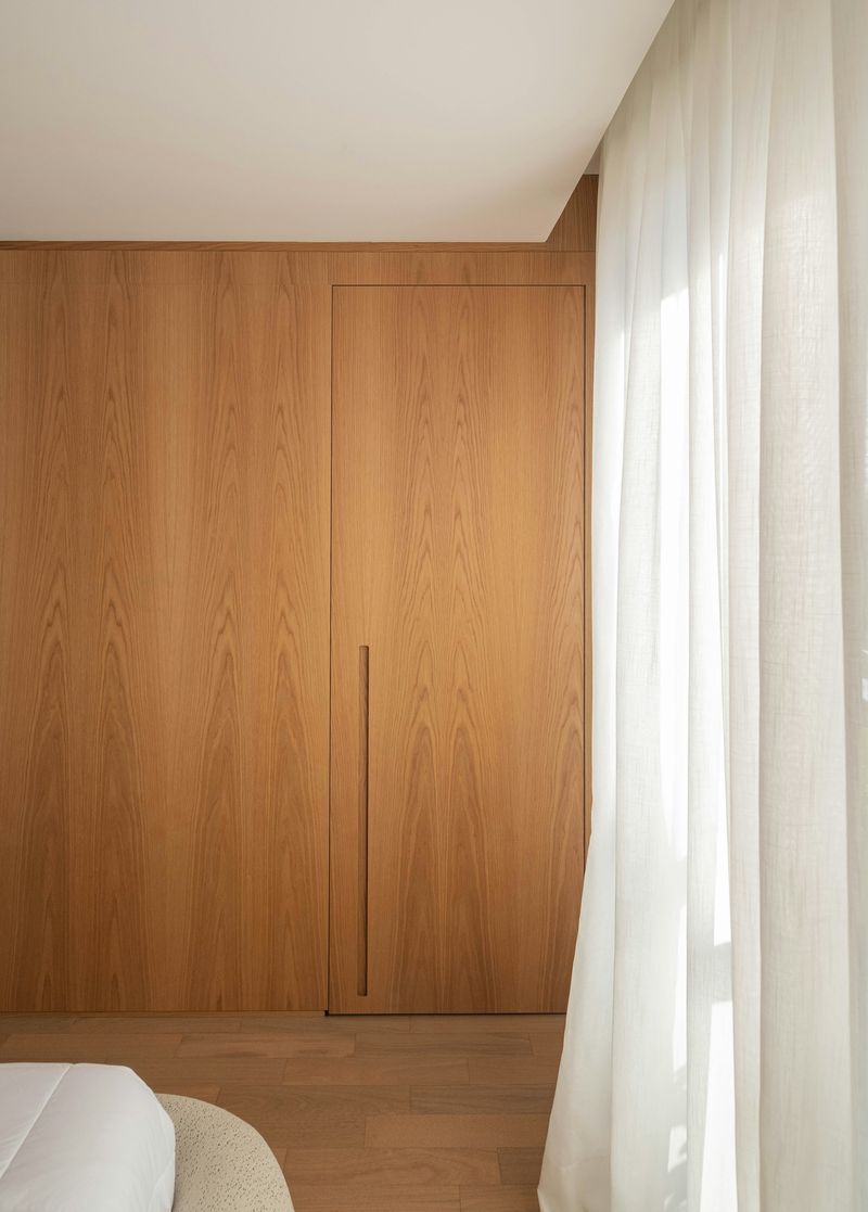 Wood-paneled corridor and curtain detail, Carlsbad.
