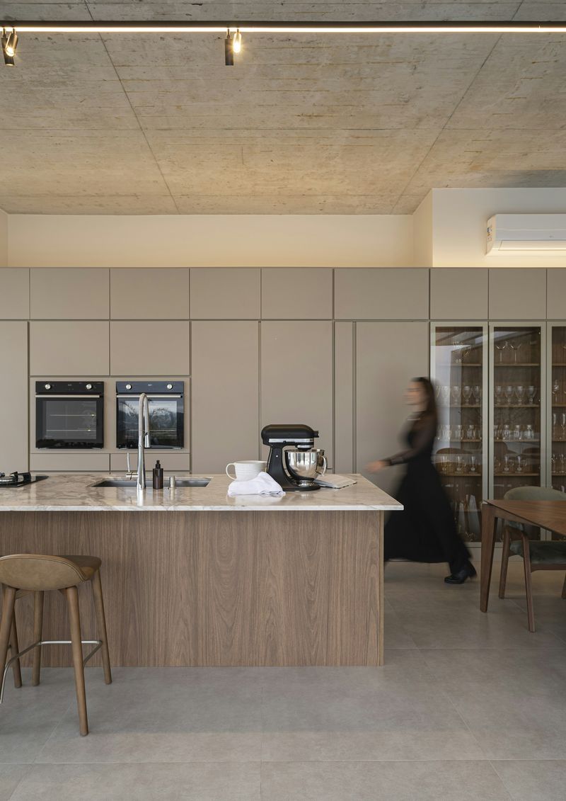Editorial kitchen wide shot with sectional, Oceanside vacation rental.